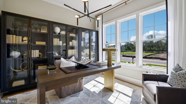 home office with an inviting chandelier