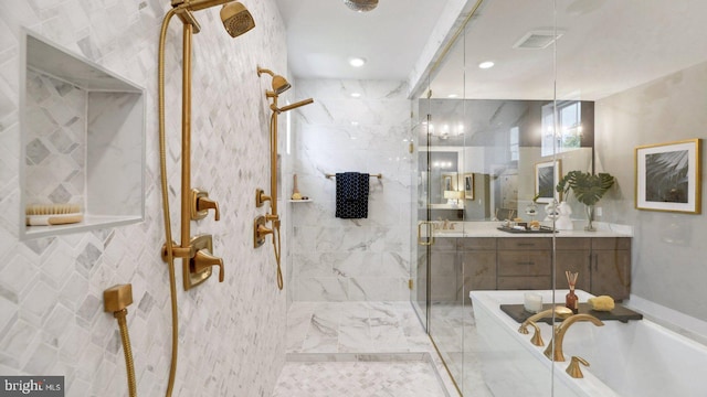 bathroom featuring separate shower and tub and vanity