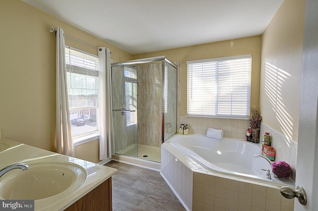 bathroom with vanity and plus walk in shower