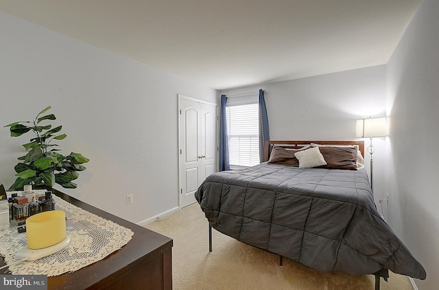 bedroom featuring light carpet