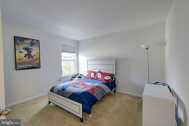 bedroom with light colored carpet