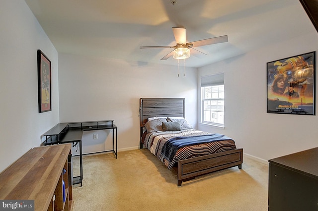 bedroom featuring ceiling fan and light carpet