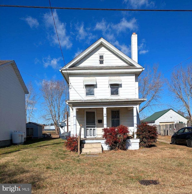 view of front of home featuring a front lawn and covered porch