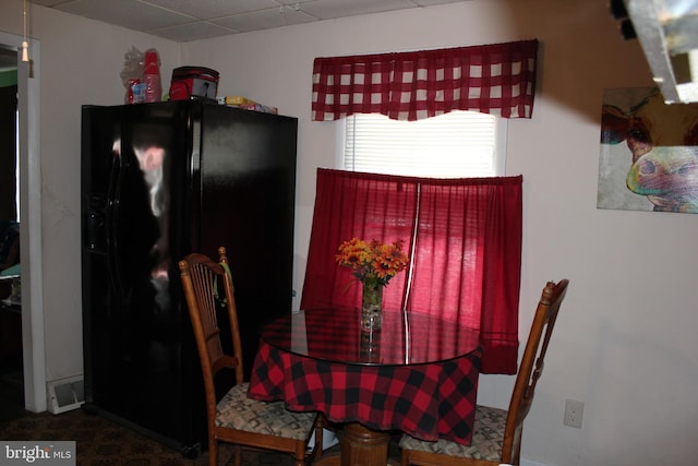 dining room with a drop ceiling