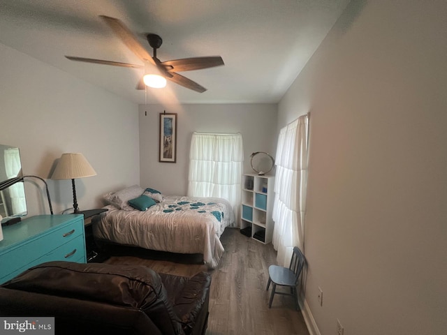 bedroom featuring hardwood / wood-style floors and ceiling fan