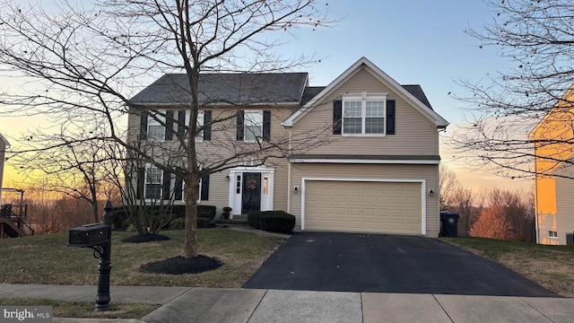 view of front of property featuring a garage