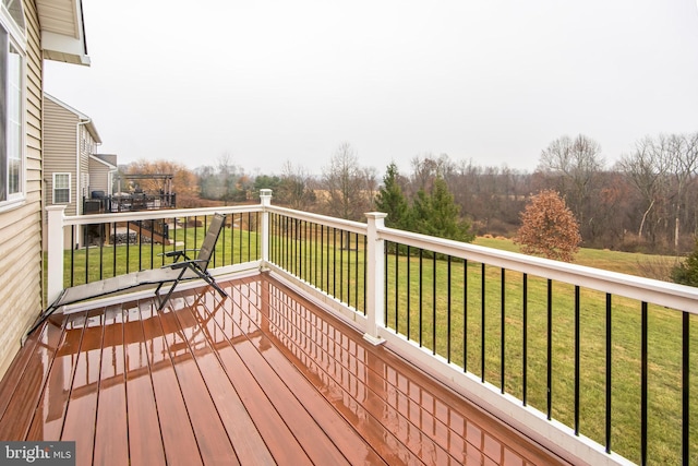 deck featuring a lawn