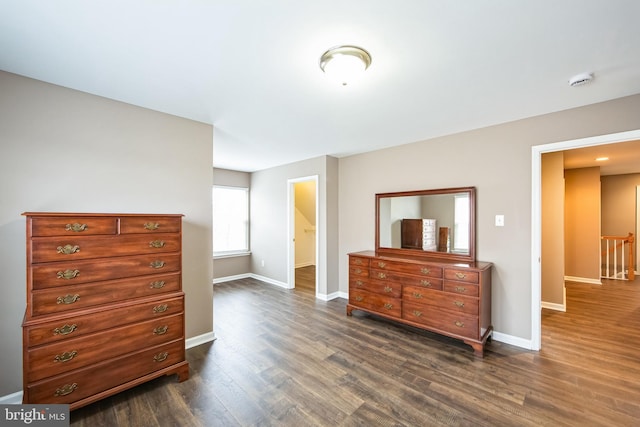 bedroom featuring dark hardwood / wood-style flooring