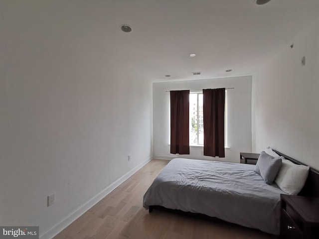 bedroom with light hardwood / wood-style flooring