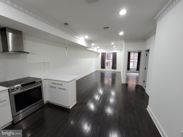 kitchen with white cabinets, kitchen peninsula, wall chimney exhaust hood, and stainless steel electric stove