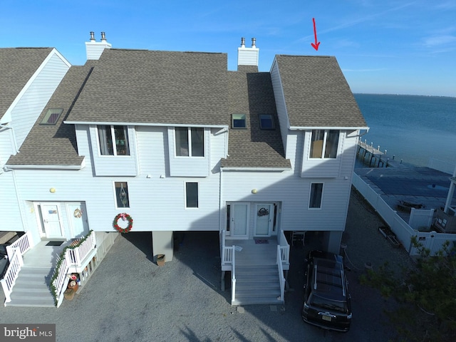 exterior space with a water view