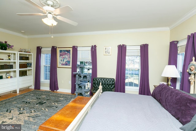 bedroom featuring crown molding, ceiling fan, and hardwood / wood-style floors