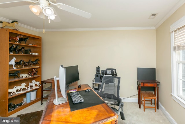 office area featuring crown molding, a healthy amount of sunlight, and light colored carpet