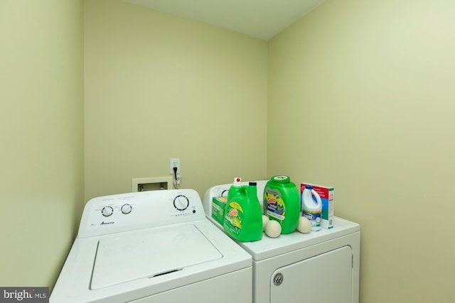 laundry room featuring washer and clothes dryer