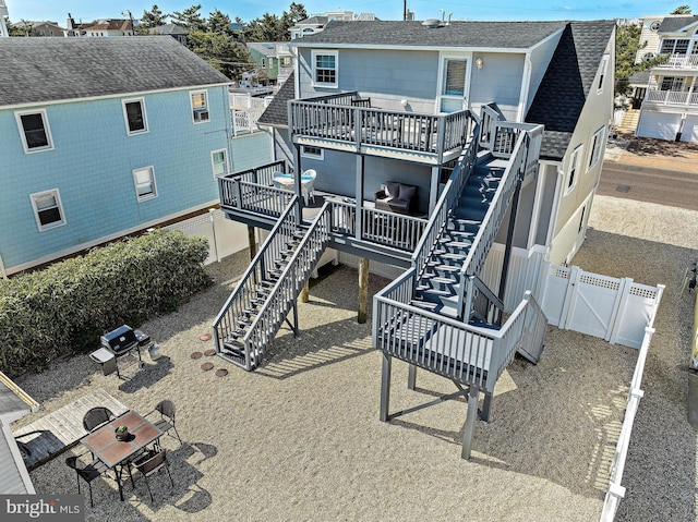 rear view of property with a wooden deck