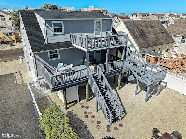 rear view of property with an outdoor hangout area and a deck