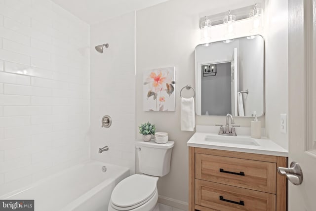 full bathroom with vanity, toilet, and tiled shower / bath