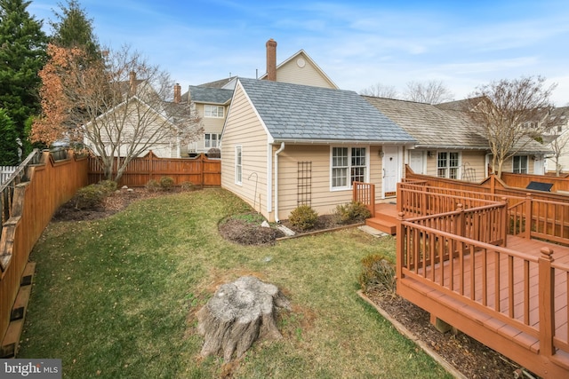 exterior space with a yard and a deck