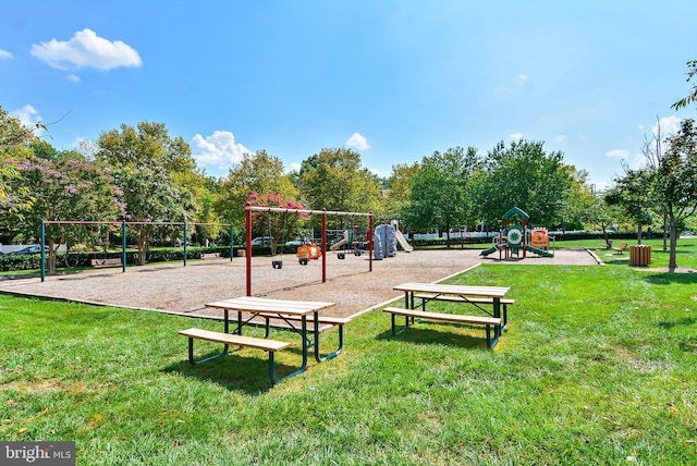 surrounding community with a lawn and a playground