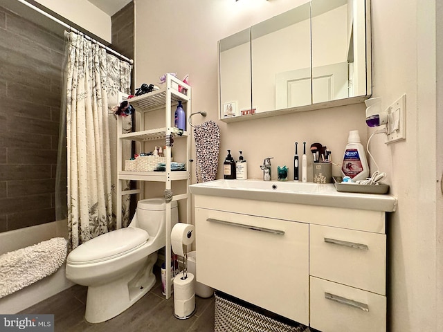 full bathroom with hardwood / wood-style floors, vanity, toilet, and shower / bath combination with curtain