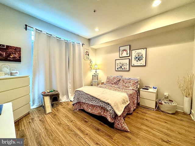 bedroom featuring light hardwood / wood-style flooring