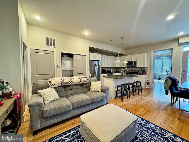 living room with light hardwood / wood-style flooring