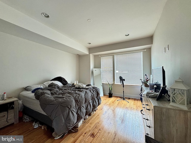 bedroom with light hardwood / wood-style floors