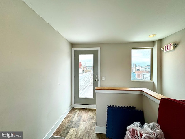 doorway to outside with hardwood / wood-style flooring and plenty of natural light