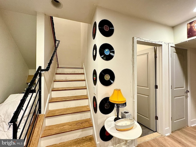 stairway featuring hardwood / wood-style flooring