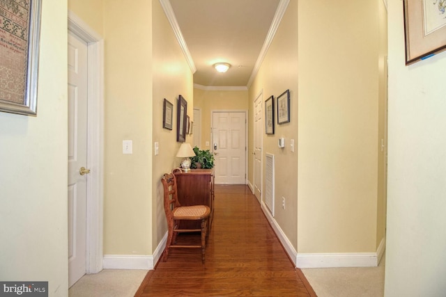 hallway featuring crown molding and hardwood / wood-style floors