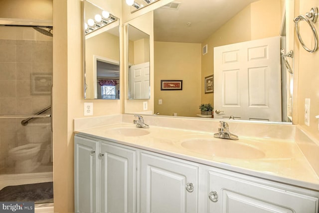 bathroom featuring vanity and an enclosed shower