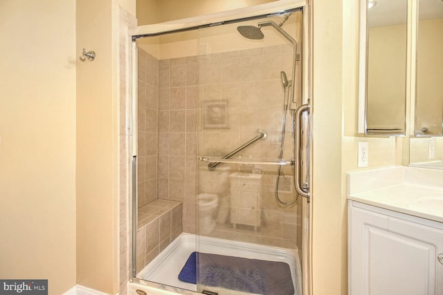 bathroom with vanity and an enclosed shower