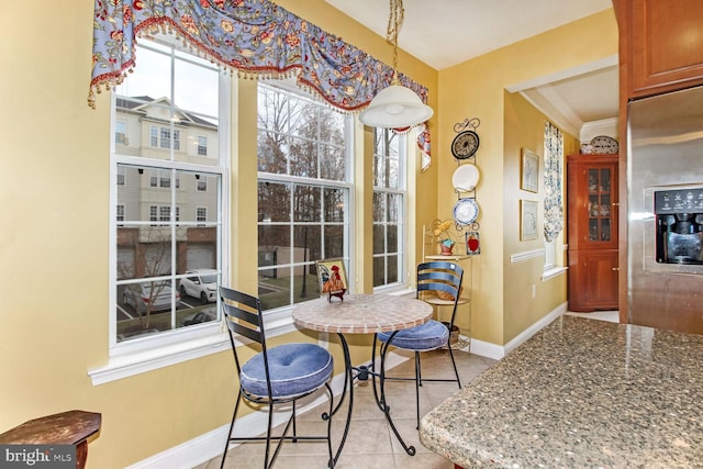 dining area with light tile patterned floors