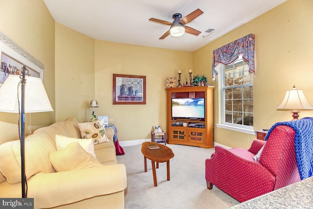 living room with light colored carpet and ceiling fan