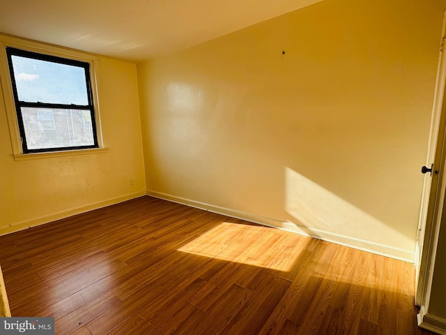 empty room featuring hardwood / wood-style flooring