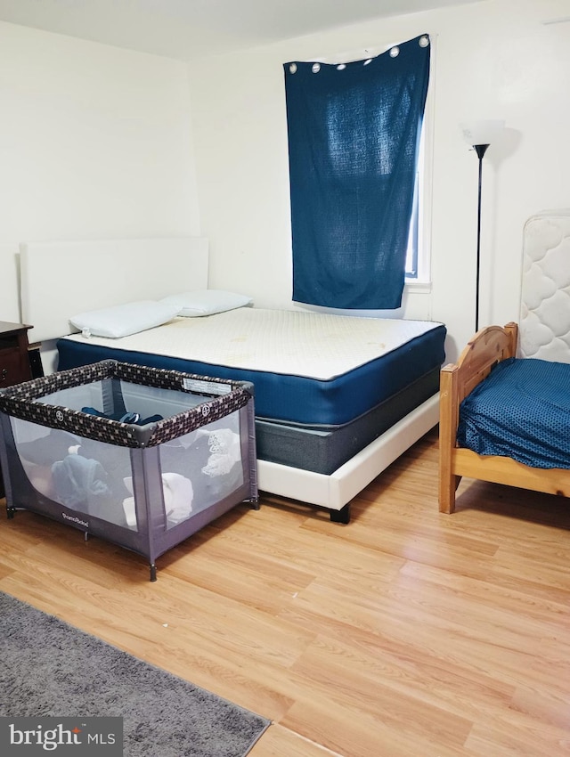 bedroom featuring hardwood / wood-style floors