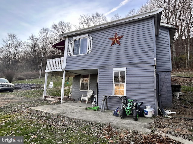 rear view of property with central air condition unit