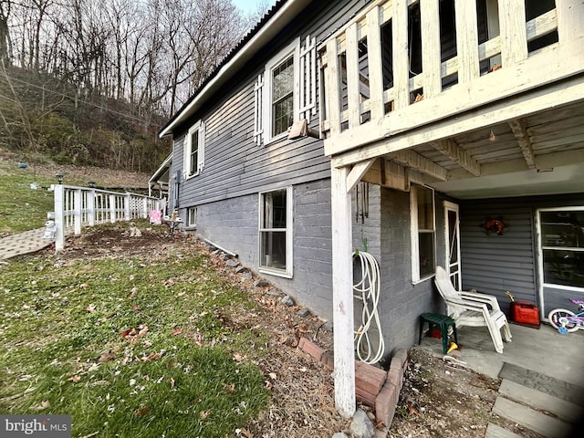 view of property exterior with a patio