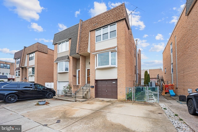 multi unit property featuring a garage