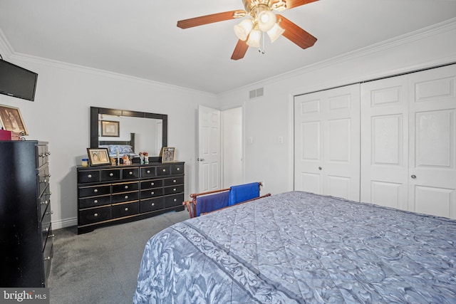 bedroom featuring dark colored carpet, ceiling fan, ornamental molding, and a closet