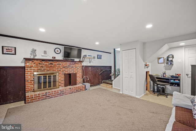 living room featuring a fireplace and carpet floors