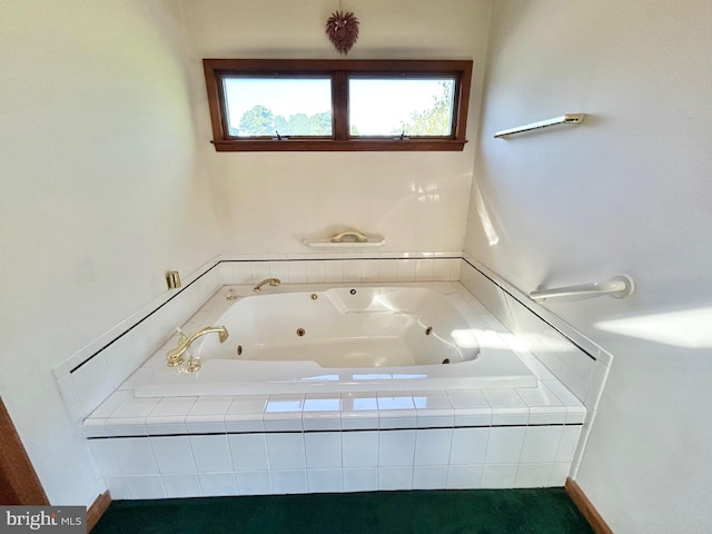 bathroom featuring a relaxing tiled tub