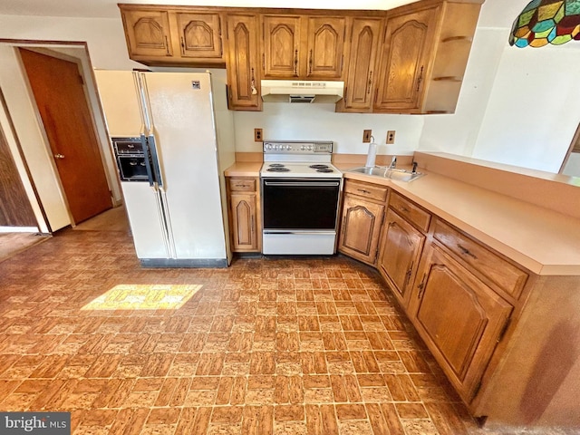 kitchen with white appliances and sink