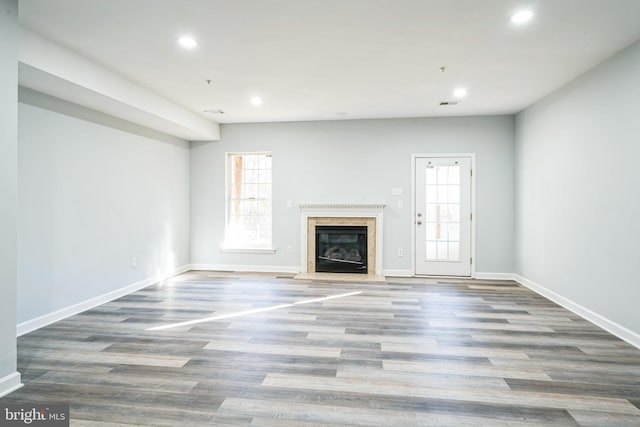 unfurnished living room featuring hardwood / wood-style floors