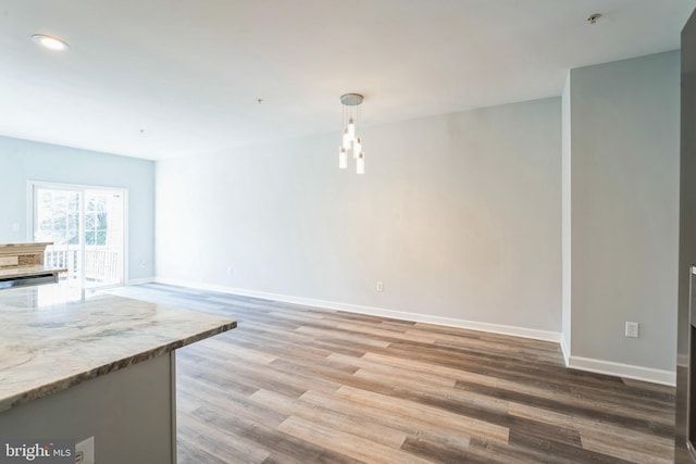 unfurnished living room with light hardwood / wood-style flooring