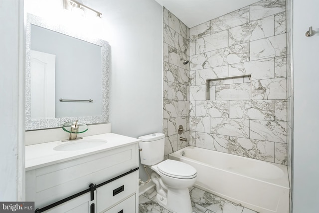 full bathroom with vanity, tiled shower / bath combo, and toilet