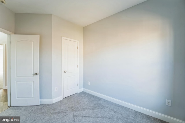 unfurnished bedroom with light colored carpet