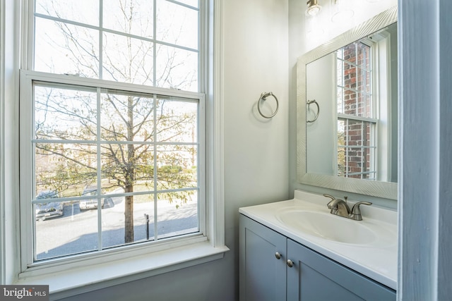 bathroom with vanity and a wealth of natural light