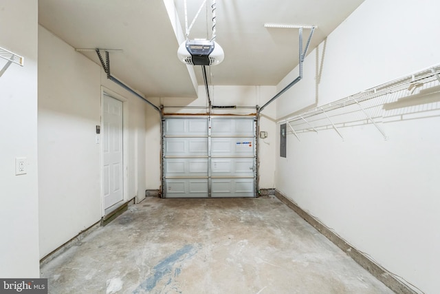 garage featuring electric panel and a garage door opener