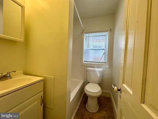 bathroom featuring tile patterned floors, vanity, and toilet